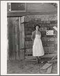 Farm woman beside her barn door. Tulare County, California. No more horseshoes!