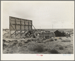 Three families camped on the plains along U.S. 99 in California