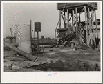 This pumping plant for irrigation is powered by a natural gas engine which operates at about half the cost of electricity. Tulare County, California