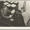 Night meeting in the Farm Security Administration (FSA) office, Rural Rehabilitation Division, Visalia, Tulare County, California. 144 families have applied for Farm Purchase Loans under the Farm Tenancy Act, passed by Congress in 1937