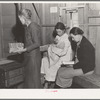 Hymn singing at meeting of Mothers' Club in Arvin migrant camp. California