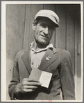 From Oklahoma farm (April 1938) to strike leader in California. Cotton strike (Nov. 1938). He displays his union membership book. "Vote No on No. 1" refers to proposed anti-picketing law which was later defeated by California electorate. Kern County, Cal.