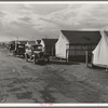 Shafter camp for migrant workers (Farm Security Administration-FSA), California. Tent platforms are supplied. Workers supply their own tents. The newer camps are experimenting with prefabricated steel one-room houses