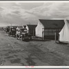 Shafter camp for migrant workers (Farm Security Administration-FSA), California. Tent platforms are supplied. Workers supply their own tents. The newer camps are experimenting with prefabricated steel one-room houses