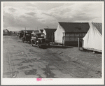 Shafter camp for migrant workers (Farm Security Administration-FSA), California. Tent platforms are supplied. Workers supply their own tents. The newer camps are experimenting with prefabricated steel one-room houses