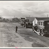 Looking from the camp to adjoining tract where the Farm Security Administration (FSA) has just completed forty homes to be occupied by low income workers. These homes represent a first step in stabilization of this group