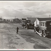 Looking from the camp to adjoining tract where the Farm Security Administration (FSA) has just completed forty homes to be occupied by low income workers. These homes represent a first step in stabilization of this group