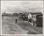 Looking from the camp to adjoining tract where the Farm Security Administration (FSA) has just completed forty homes to be occupied by low income workers. These homes represent a first step in stabilization of this group