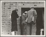 Destitute farm labor families come to Farm Security Administration (FSA) distributing depot to apply for food grant. Kern County, California