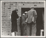 Destitute farm labor families come to Farm Security Administration (FSA) distributing depot to apply for food grant. Kern County, California