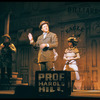 Robert Preston [center] and unidentified others in the stage production The Music Man