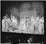Danny Carroll [left], Robert Preston [center] and unidentified others in the stage production The Music Man