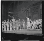 Robert Preston [center] and unidentified others in the stage production The Music Man