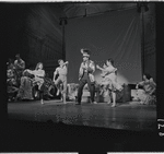 Robert Preston [center] and unidentified others in the stage production The Music Man
