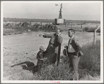 Rural rehabilitation client talking with county supervisor, Farm Security Administration (FSA), Tulare County, California. She says: "Someday I'm going to build my house. Right over there by that garden."