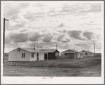 Looking from the camp to adjoining tract where Farm Security Administration (FSA) has just completed forty homes to be occupied by low income workers