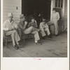 South Carolina. Livery stable gang talking politics in the country of Senator "Cotton Ed" Smith