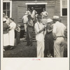 As the auctioneer knocks down the last bid on each basket of tobacco in the warehouse, the price is immediately recorded, and the farmers go to the "money box" to get their money. Douglas, Georgia