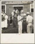 As the auctioneer knocks down the last bid on each basket of tobacco in the warehouse, the price is immediately recorded, and the farmers go to the "money box" to get their money. Douglas, Georgia