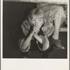Kern County, California. Undernourished cotton picker's child listening to speeches of organizer at strike meeting to raise wages from seventy-five cents to ninety cents a hundred pounds. Strike unsuccessful