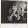 Kern County, California. Undernourished cotton picker's child listening to speeches of organizer at strike meeting to raise wages from seventy-five cents to ninety cents a hundred pounds. Strike unsuccessful