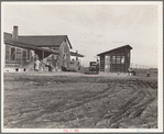 Outskirts of Firebaugh. West side of San Joaquin Valley, California. Six families with twenty-two children live in this house. Cotton workers: "He's good (the boss). He lets us live here without paying rent"