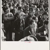 Listening to speeches at mass meeting of Works Progress Administration (WPA) workers protesting congressional cut of relief appropriations. San Francisco, California