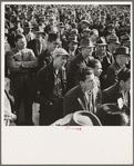 Listening to speeches at mass meeting of Works Progress Administration (WPA) workers protesting congressional cut of relief appropriations. San Francisco, California