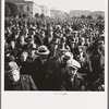 Listening to speeches at mass meeting of Works Progress Administration (WPA) workers protesting congressional cut of relief appropriations. San Francisco, California