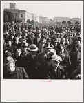 Listening to speeches at mass meeting of Works Progress Administration (WPA) workers protesting congressional cut of relief appropriations. San Francisco, California