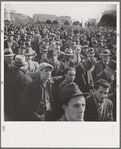 Listening to speeches at mass meeting of Works Progress Administration (WPA) workers protesting congressional cut of relief appropriations. San Francisco, California