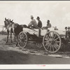 Horse and wagon is still a common means of transportation. Family coming from town on a Saturday afternoon. Southeast Missouri Farms