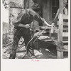 In Arkansas Hills (Ozarks) near Seligman, Missouri, splitting hickory for chair-bottoms. His father before him and his son after him make furniture for a living