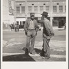 Calipatria, Imperial Valley. Idle pea pickers discuss prospects for work. California