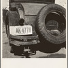 Temporary auto license. A common sight in migratory labor camps. Many enter California after cotton picking in Arizona without sufficient money to buy license plates. California