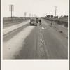 Passing motorist gives walking family of seven a lift to the next town. See 19075. California