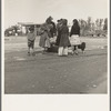 After a lift of five miles by a passing motorist, the family of homeless, walking people are left at the edge of the next town [near Brawley, California]