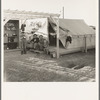 Pergola, cupboard, and tent platform are standard equipment of Farm Security Administration (FSA) migratory labor camp. Brawley, Imperial County, California