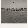 Marble time in Farm Security Administration (FSA) migratory labor camp (emergency.) Plenty of space to play and plenty of companions for the children during pea harvest. Near Calipatria, Imperial Valley, California