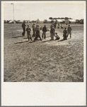 Marble time in Farm Security Administration (FSA) migratory labor camp (emergency.) Plenty of space to play and plenty of companions for the children during pea harvest. Near Calipatria, Imperial Valley, California