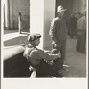 Pea pickers waiting at Farm Security Administration (FSA) office for issue of surplus commodities. Calipatria, California