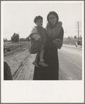 On U.S. 99. Near Brawley, Imperial County. Homeless mother and youngest child of seven walking the highway from Phoenix, Arizona where they picked cotton. Bound for San Diego, where the father hopes to get on relief "because he once lived there."