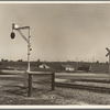 Migrants' tents are a common sight along the right of way of the Southern Pacific. Near Fresno, California