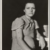 Daughter of migratory family in Farm Security Administration (FSA) labor camp. Calpatria, Imperial Valley, California
