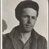 Son-in law of migratory family in Farm Security Administration (FSA) labor camp. Calipatria, Imperial Valley, California