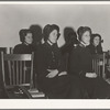 Visiting lassies sit on rostrom. Salvation Army, San Francisco, California