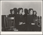 Visiting lassies sit on rostrom. Salvation Army, San Francisco, California