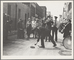 Salvation Army, San Francisco, California. Army contributes first to the tambourine (two dollars), outside contribution about seventy-five cents, all from drunks and the like