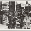 Salvation Army, San Francisco, California. Unemployed young men pause a moment to loiter and watch, and then pass on