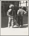 Outside the Farm Security Administration (FSA) grant office during the pea harvest. Calipatria, California. During spring of 1938 for the first time, the labor surplus had grown so large that relief grants were necessary even during the peak of harvest. Colored migrants are becoming more numerous this year